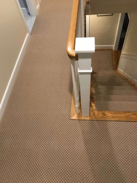 Wood stairs with carpet runner custom cut